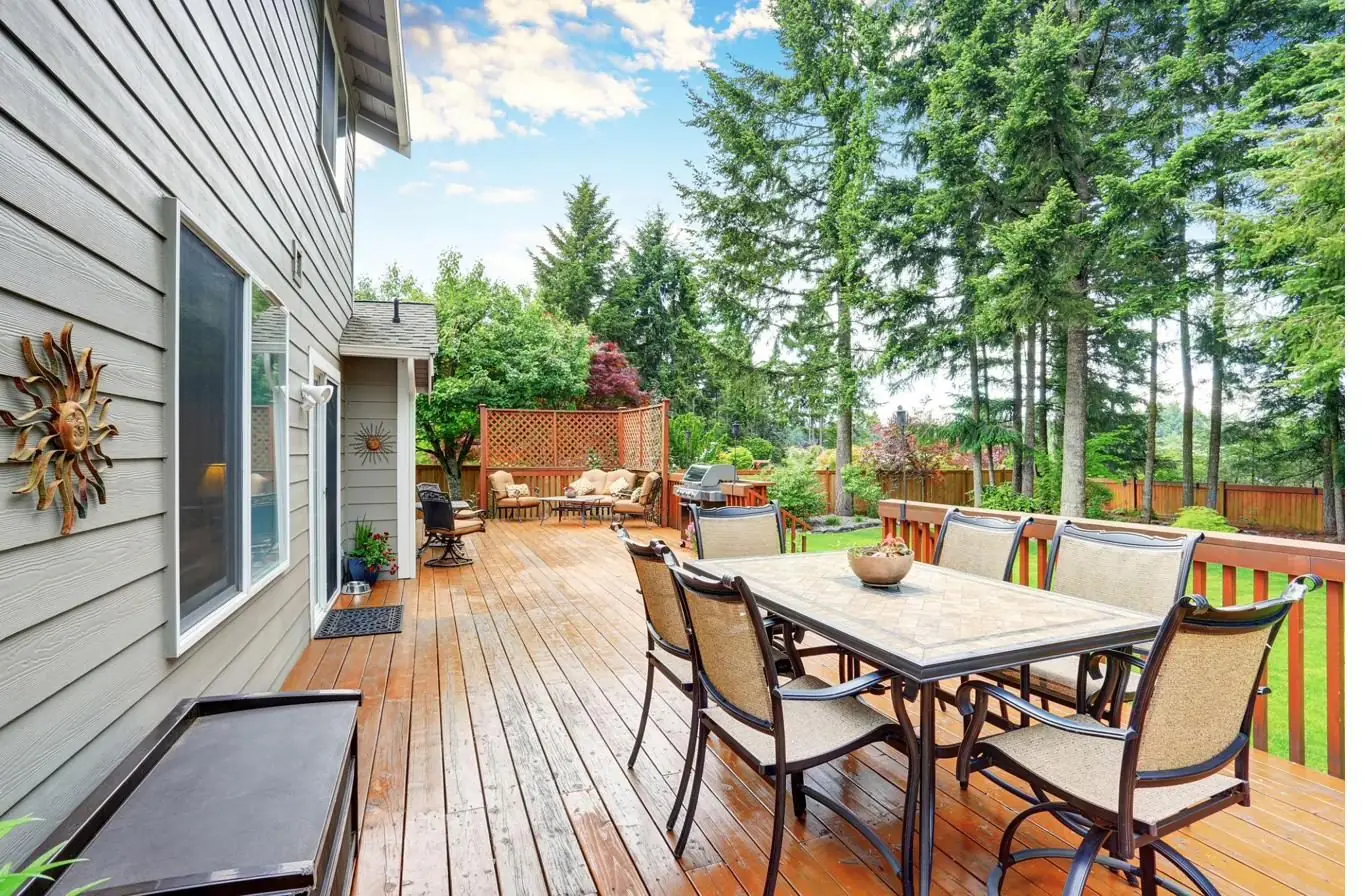Finished backyard deck with dining furniture
